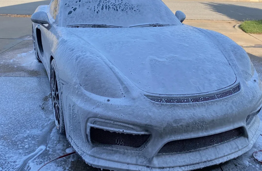 Exterior of a car being washed and dried by hand